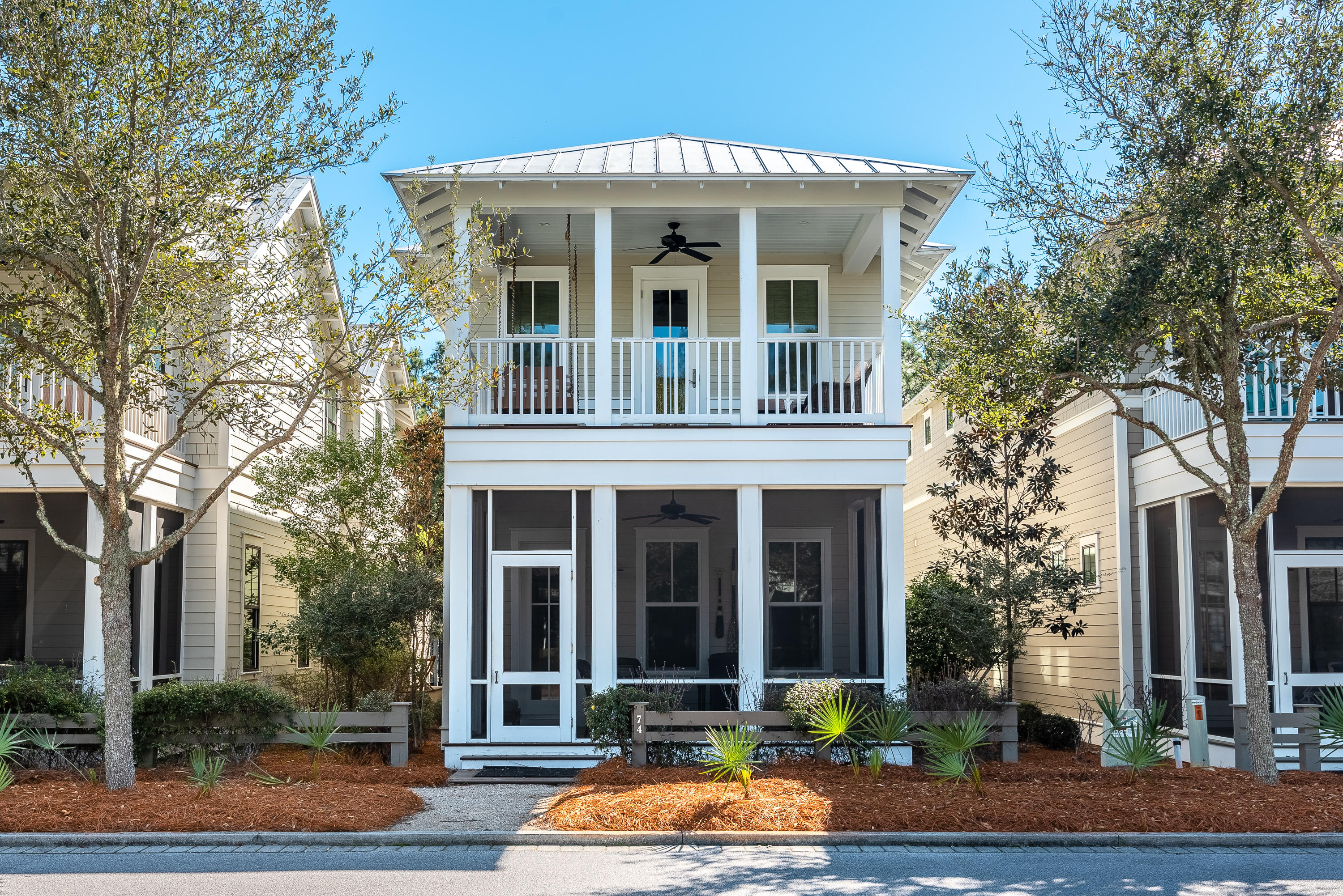 This charming 4BR/4.5 BA + bunk WaterColor cottage makes an ideal beach retreat with beautiful light-filled spaces, designer furnishings, and an accommodating design with room for everyone. The screened front porch welcomes you into a spacious and open living and dining area highlighted by wood floors, cottage-style millwork, and a neutral color palette. The kitchen will delight any chef with stainless-steel appliances, granite countertops, a breakfast bar with seating for four, a subway tile backsplash, and custom lighting.
