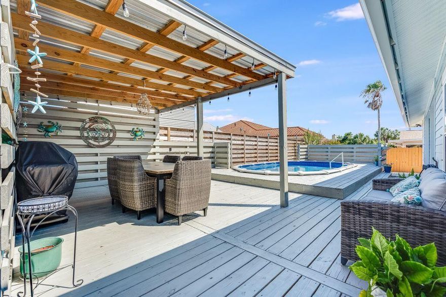 Welcome to this stunning 4-bedroom house, situated just blocks away from dedicated Bid-A-Wee beach with 5 convenient access gates and over 2000 square feet of private beach. This charming home, built in 2018, offers a perfect blend of modern elegance and coastal living. Upon entering, you'll be greeted by a spacious and inviting interior, boasting an abundance of natural light and a seamless flow throughout. The open-concept design seamlessly connects the living, dining, and kitchen areas, providing a great space for entertaining family and friends. The kitchen is a chef's delight, featuring stainless appliances, ample storage, and a center island for added convenience. Granite countertops and stylish cabinetry complete the space, creating an ideal setting for culinary adventures.