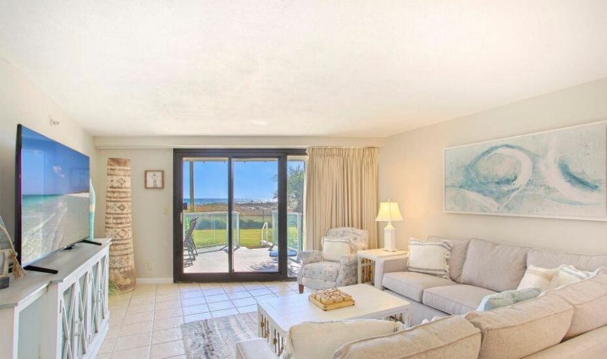 MOTIVATE SELLER..!    BEACH FRONT WITH OCEAN VIEWS. This Newly Renovated unit is at Beach Level with easy access to the Beach and pool, features a covered patio facing the Gulf with steps to walk out onto the grass. Walk over the dunes and enjoy the beautiful emerald green waters of the gulf. No elevators, walk from your vehicle into your condo.