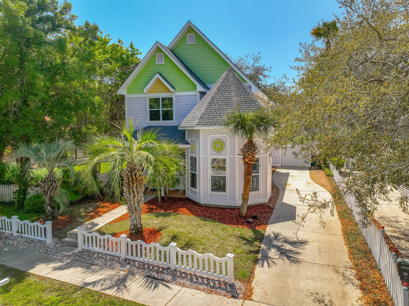 A Coastal Victorian Gem - A Home Unlike Any Other.'Nestled just three blocks from Destin's pristine beaches, this one-of-a-kind Victorian-style home offers a refreshing departure from the typical beach house. Its timeless charm, superior construction, and unrivaled location make it a standout property that blends the best of both worlds -- historic elegance and modern convenience. Perched 32 feet above sea level, this home sits on one of the highest points in Destin. Enjoy serenity and privacy, yet be only moments away from the beach. With 12-foot ceilings, 10-foot doors, and 2x6 walls, this house radiates grandeur and quality. The octagonal office, with its soaring 16-foot ceiling, is an architectural masterpiece, offering a versatile space for a home office, studio, bunk room or even a 4th bedroom. Inside, traditional touches such as wainscoting, built-in bookcases, a gas fireplace, and custom crown molding create a warm and inviting atmosphere. Espresso hardwood bamboo flooring runs throughout the home, enhancing the sense of space and light. The kitchen has been recently updated with contemporary white cabinetry, granite countertops, and stainless steel appliances. A chic breakfast bar with colorful pendant lighting adds a playful touch to the space. Whether cooking for family or entertaining guests, the kitchen is both functional and stylish. The separate garage adds value by providing parking out of the elements, extra storage and potential workspace, enhancing convenience and organization while increasing property appeal for buyers seeking this versatility. Full-time owners and seasonal guests alike enjoy the convenient location, neighborhood pool and fish ponds Sovereign Isle has to offer. In the last 5 years this low maintenance Victorian gem has received a new refrigerator and stove-2025, a/c, water heater and dishwasher along with a new roof in 2022. Come see for yourself.