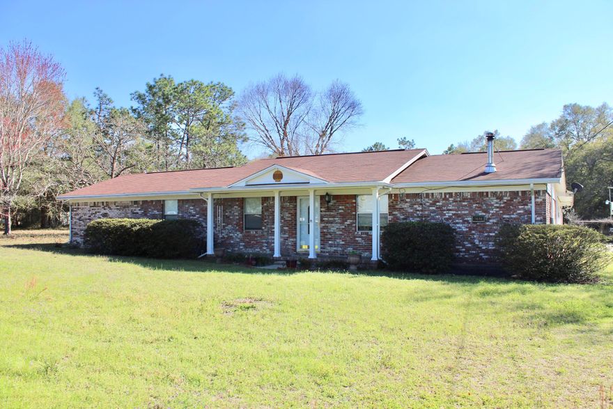 Well maintained country home on over an acre level lot. All hard floors except bedrooms. Seller is willing to give flooring allowance with acceptable offer. 2 Car garage with separate storage/workshop. Oversized workshop has electric and A/C. Also storage shed and gazebo have electric. Many fruit bearing trees on property (pecans, lemons, pomegranate) just to name a few. Don't let this rare find slip away.