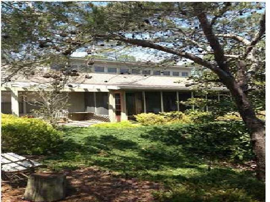 239 ft of lake front with gulf views and a 30' elevation this unique 2.57 acre property offers it all with plenty of room to expand if you chose to. Located in Four Mile Village and Coffeen Nature Preserve this property also borders on Tops'l Hill State Park. Fish from your private dock and kayak in this 60 acre lake. This 3 bedroom 2 bath home offers a large open great room and kitchen with views literally straight through to the lake to the north and the dunes and the Gulf of Mexico to the south...There are both an open deck and screen porch on the beach side and plenty of room to relax under the magnificent oak trees on the lake side. Split plan with large master bedroom and bath on one side of the living area and two bedrooms and bath on the other side. Home also was designed with