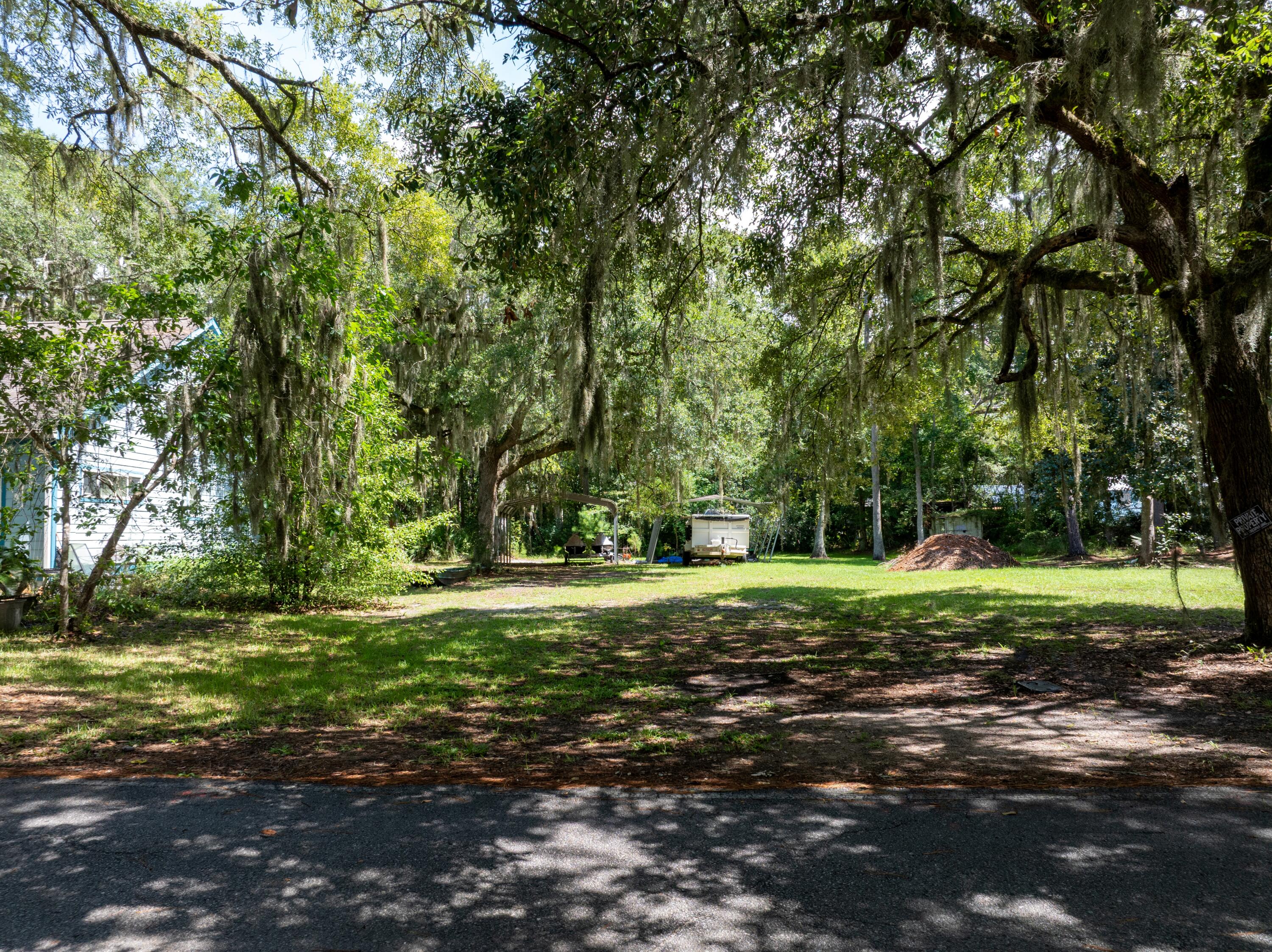 A Bay View Retreat Waiting to Be DiscoveredTucked away on a quiet road shaded by towering live oaks, this cleared lot offers more than just land--it offers a way of life. From your future front porch, you'll gaze out across the tranquil waters of Jolly Bay, where every sunrise dances on the ripples and every sunset paints the sky in soft golds and fiery reds.Just steps away, the bay invites you to slow down and savor the moment. Launch your kayak for a peaceful paddle through still waters, cast a fishing line from the shore, or simply sit with your toes in the sand and watch the tide roll in. The community's rare bay access, right across the street, is your gateway to quiet mornings and starlit evenings on the water. Here, nature sets the pace, but you're never far from the conveniences of life. Just minutes away, the City of Freeport offers small-town charm, while the white sand beaches of 30A and the vibrant energy of the Emerald Coast are only a short drive from your doorstep.
No HOA. No flood insurance required. Utilities at the road. All that's missing is your vision for a custom home or investment retreat that embraces the rhythm of bay life.
This isn't just property...it's a place where the water calls, the trees whisper, and life moves with the gentle flow of the tides.
***All dimensions shown in listings, plat and/or photos are approximate only. Buyer will be responsible to complete due diligence to ensure accuracy of all information.
Taxes based on both Lot 2 & Lot 3 combined and will be separated at closing.