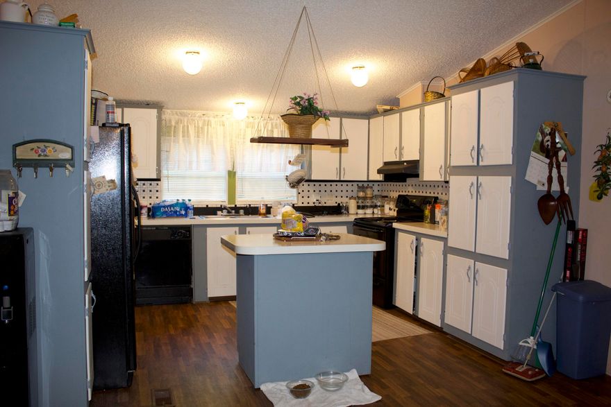 Beautiful 4 acre lot with lots of privacy and close to town. 4 bedroom 2 and half bath mobile home that has a split floor plan. Large master bathroom with a stand up shower, soaking tub, and double vanity. Huge walk in closet with built in shelves and a safe. Kitchen has a lot of cabinet space and all black appliances. There are 2 sheds and a green house on the property providing plenty of storage space. Amazing deck giving you a great place to entertain!This is a must see!