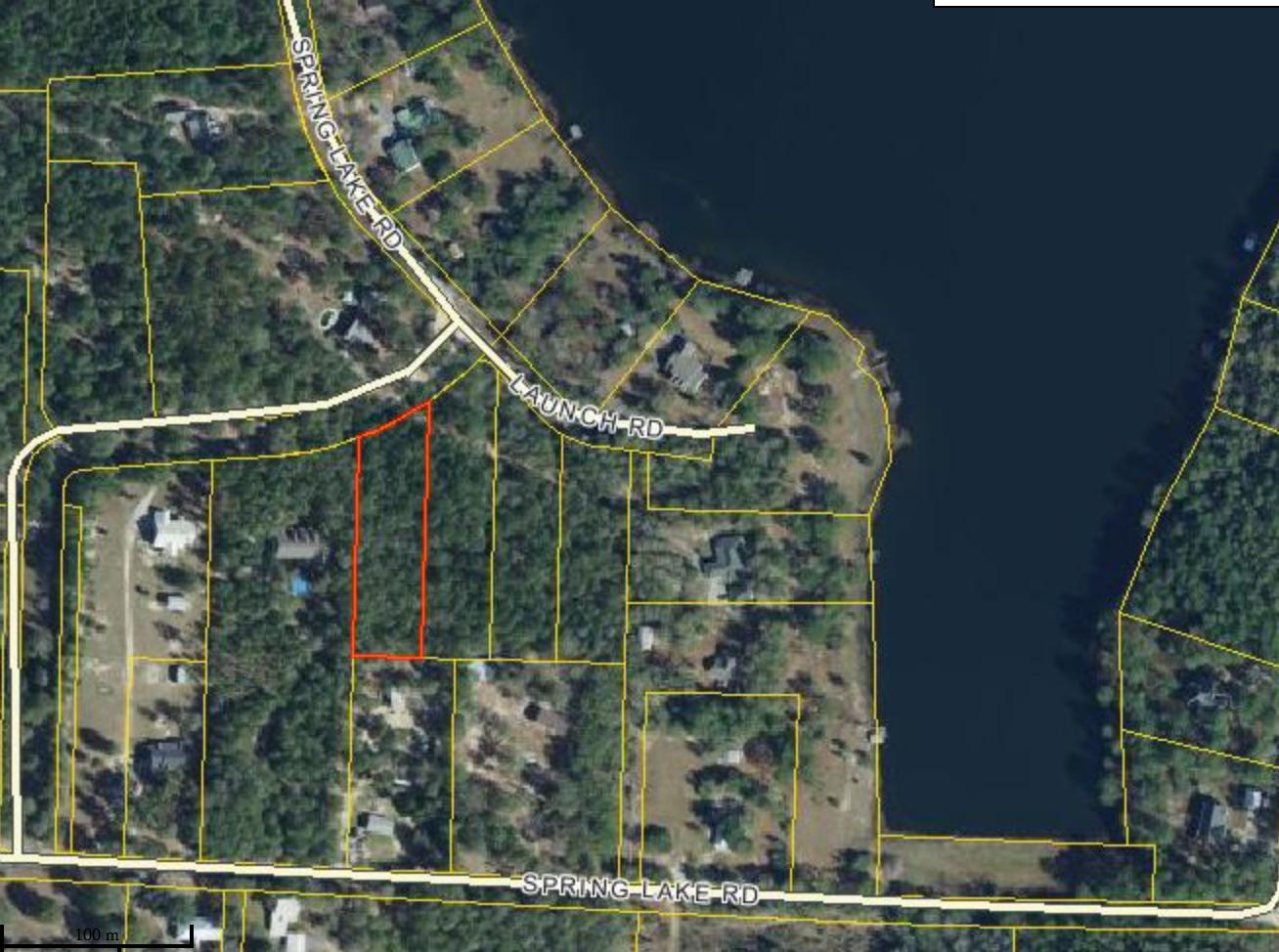 Beautifully completely level, wooded 1.19 acre lot with access to gorgeous Spring Lake, literally just around the corner. Potential water views in a new home.