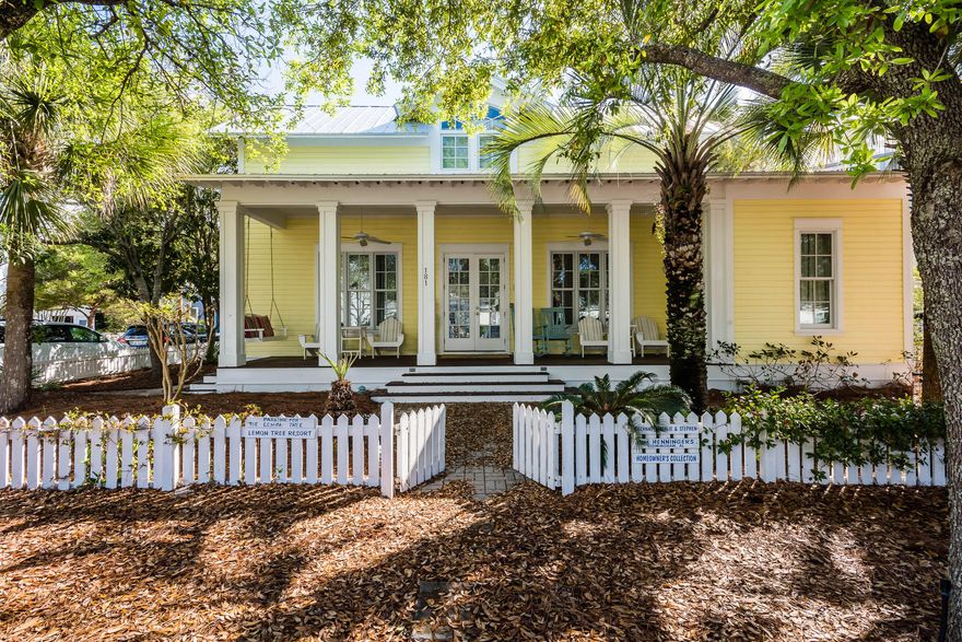 Located in the heart of Seaside, this charming 4 bedroom, 4 bath beach cottage is found on a very private lot with no other homes directly adjacent to it on Smolian Circle; backing up to Ruskin Square and across the street from the picturesque Seaside School. The quaint white picket fence wraps around the home's large landscaped yard, welcoming you to The Lemon Tree! The expansive front porch is perfect for gathering, people watching or relaxing with a good book on the cozy porch swing. The home's double door front entry welcomes you to the vast living area with wood floors, soaring vaulted ceiling and a skylight window in its peak, where family memories are waiting to be made. With 12 foot ceilings throughout, the dining space has seating for six and a breakfast bar leading into the kitc