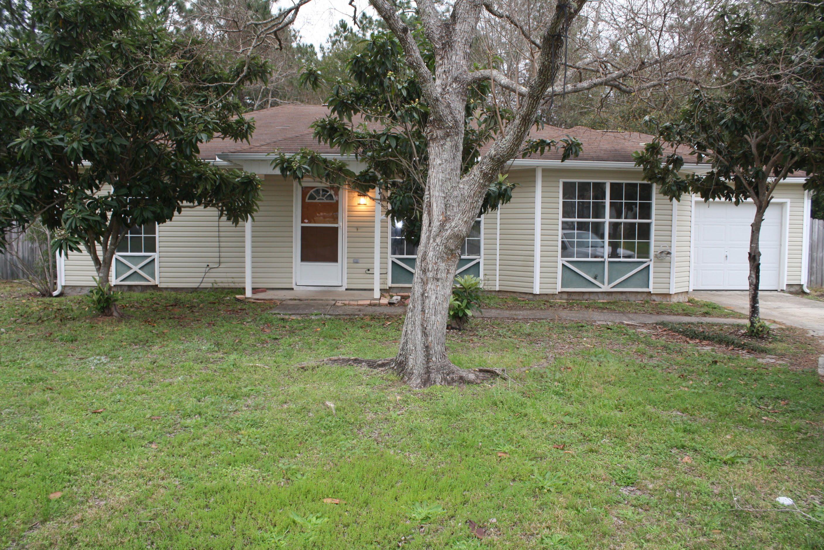 This house won't last long! This split floor plan 3 bedroom 2 bath is just the house for you! As you walk in the living room you will notice the vaulted ceilings, wood floors and neutral painted walls. The kitchen boasts white appliances, and tiled countertops. Bedrooms all have carpet throughout and neutral painted walls. One car garage and large backyard completes this rental.