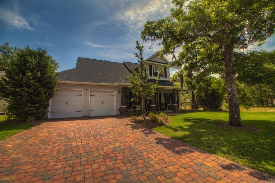 Welcome to The Parish at Bluewater Pointe! You will love this quaint New Orleans style neighborhood, located on Ward's Cove with beautiful views of the Choctawhatchee Bay. This neighborhood is lined with charming street lamps, along with paver-stoned streets and driveways. After a long day at the office, enjoy an evening stroll to the community dock to watch the sunset.This 4 bedroom home has 10 Ft. ceilings, crown molding, hardwood floors, stainless steel appliances, granite countertops in the kitchen, all baths, and the laundry room. The open floor plan offers views into the living room, dining area and backyard. Light pours through the many tall French doors and windows; already dressed with 2'' plantation shutters.