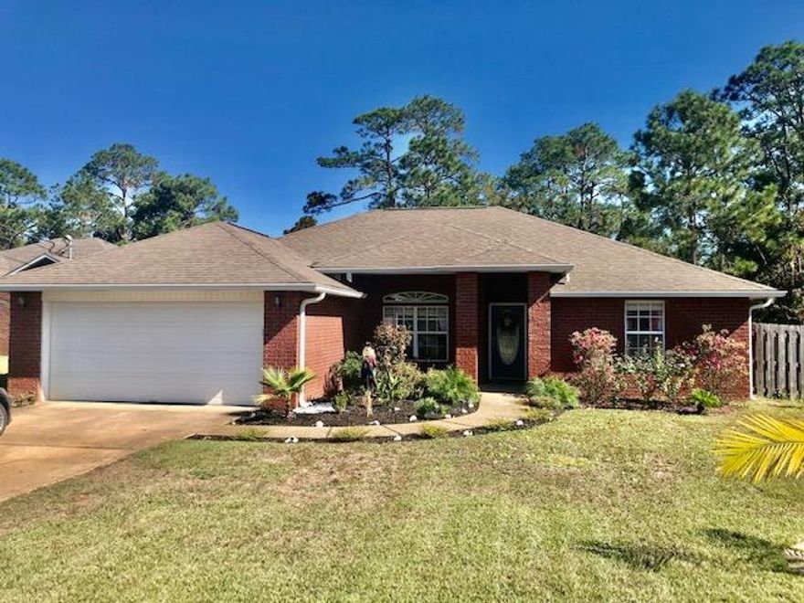 Beautiful single-level all brick home, nestled on an over-sized lot; backed up to a peaceful protected land. BEAUTIFUL FAMILY HOME-This 1800 sq. ft. home features 3 bedrooms, 2 bathrooms, dining/office space, great room with high vaulted ceilings and an eat-in-kitchen. The master suite features a relaxing soaker tub, separate shower, 2 walk-in closets, double vanity and an abundance of natural light. The 2 additional bedrooms are ideal for school-aged children with plenty of closet space.GREAT LOCATION-Walking distance to up and coming powerhouse Navarre High, which will keep you close to the action of RAIDER Football. You are minutes from dining and ''the best keep secret'', Navarre Beach. Sellers will give 2K for appliances/carpet or fencing and will pay 2% in closing cost.