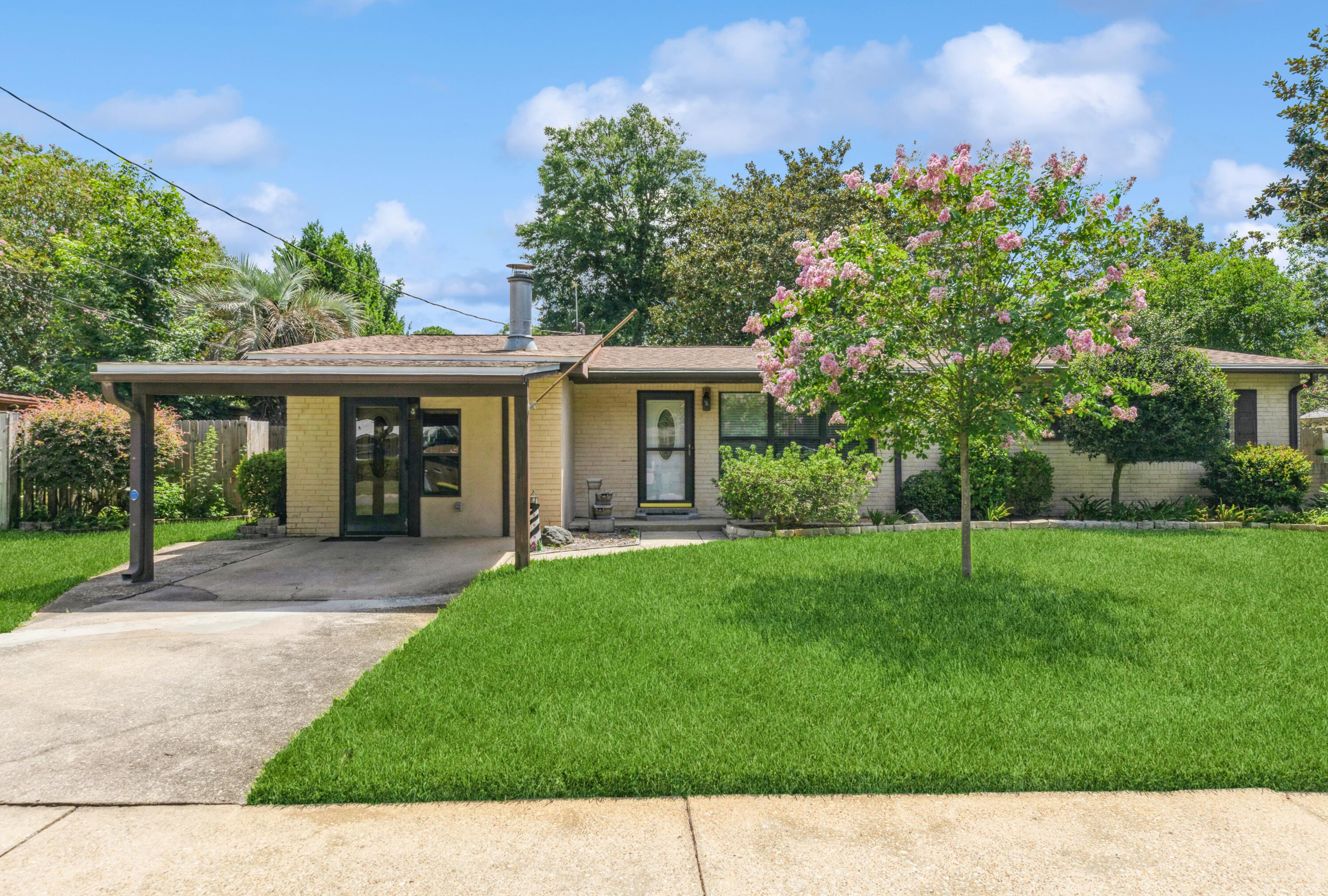 PRICE IMPROVEMENT! This well maintained home has updates to include roof, electrical, plumbing. LVP flooring throughout the Living room and dining room and an Italian made Rialto tile in laundry room, kitchen, family room, great room and office. Two entrances into the home. One leads into the family room, a large flex space, and one enters into the main living room. Enjoy your view of the paradise looking back yard with koi pond from the great room or on the covered back deck. All fenced in for privacy and to keep your fur babies in the yard. Granite counter tops in kitchen with SS appliances, opens into the dining room. Approx. 2 miles east of Hurlburt, approx. 15min Drive to Eglin. The white sandy beaches of Navarre approx. 14 miles. And the beaches of the Emerald Coast approx 12 miles! Wiring updated to Copper wiring 6/2023
Roof 10/2020
Plumbing 2017
HWH 2013
HVAC approx 2013
Double pane windows