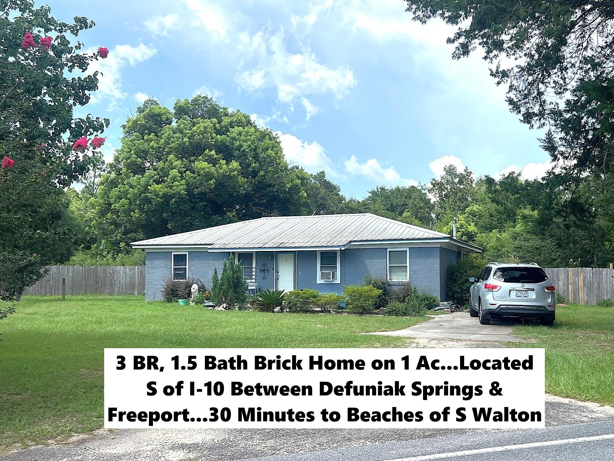 Location, Location...and priced to sell!! You'll want to move fast on this one! Cozy 3 BR, 1.5 bath brick ranch on 1 acre. Conveniently located S of I-10 between Defuniak Springs & Freeport, and apx. 30 minutes from the beaches of S Walton. Home does need some cosmetic touches, but is in overall good condition. The home sits on a 1 acre corner lot, with apx. 1/2 acre fenced back yard. Currently an above ground pool in back, but plenty of room for an inground pool. Having frontage on both Sherwood Rd and Chestnut St, there's also plenty of room to have a large shop, pole barn, garden area, or whatever your outdoor desires may be. Schedule your showing today!