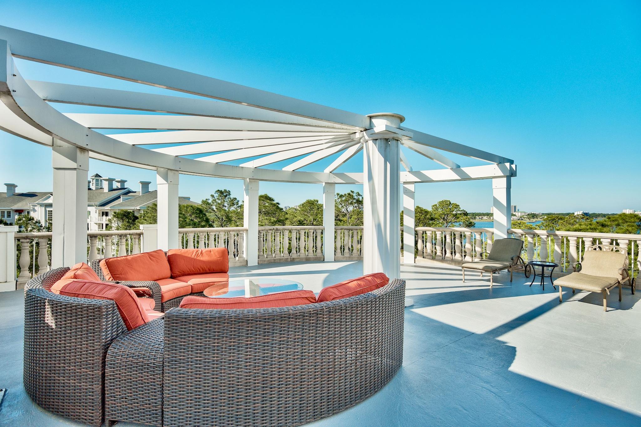 The expansive views from the wall of windows and lofty ceilings greet you the moment you walk in the double doors of this lavish penthouse condominium located in Bahia at The Village of Baytowne Wharf. Off the living area, walk through the set of over-sized double glass doors to take in sights and sunsets of the courtyards, Choctawhatchee bay, and even as far as the intercoastal waterway from the large private terrace and separate balcony (about 1400 sq. feet of balconies), or from each of the bedrooms with private access to the second balcony. Exquisite details throughout include marble flooring in the living areas and separate media room, 3 central lighting controls, 2 HVAC units, granite countertops, custom cabinetry, and a gourmet kitchen with a butler's pantry.