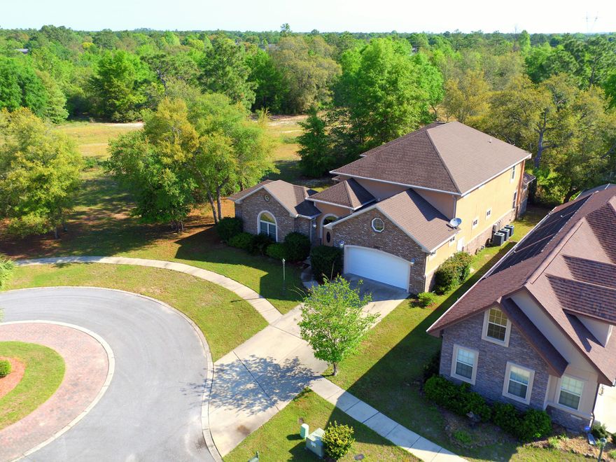This is a stunning, truly custom home with a separate mother-in-law suite for a total of 5 bedrooms and 3.5 bathrooms conveniently located south of I-10. This home is located on a private cul-de-sac in the gorgeous gated community of Chanan Estates. The exterior of stucco and brick construction is a perfect combination. Natural light is the cornerstone of this home's design with a total of six sets of French doors and many windows located all over the home. The entrance immediately lets you know you are in an elegant home as it features a foyer with a 20ft triple lighted tray ceiling. The large kitchen is appointed with a top-of-the-line double convection oven, all matching appliances, beautiful cabinetry, sleek granite counter tops, a large island with smooth cooktop and separate sink,