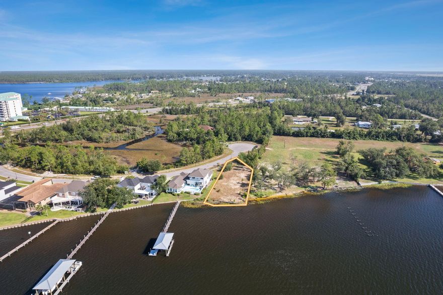 Discover an extraordinary opportunity to create your DREAM waterfront home overlooking the North Bay. This finished and cleared homesite promises boundless potential for designing a custom residence that captures the essence of luxury and tranquility. With expansive views that stretch across the water, your future home could be a true oasis.Nestled in the quiet community of Mill Point Landing, this property offers not only breathtaking water views but also convenience and accessibility. The property is also a few minutes' drive from some of the BEST restaurants in town!The potential for this land is limitless, whether you envision a sprawling contemporary home with floor-to-ceiling windows to maximize the views or a cozy retreat, perfect for relaxing and unwinding. The lot already has a seawall in place and recent survey done.  All measurements are approximate and should be verified by the buyer if important. 

These gorgeous panoramic views of North Bay could be YOURS! This beautiful lot is ready for your Dream Home!