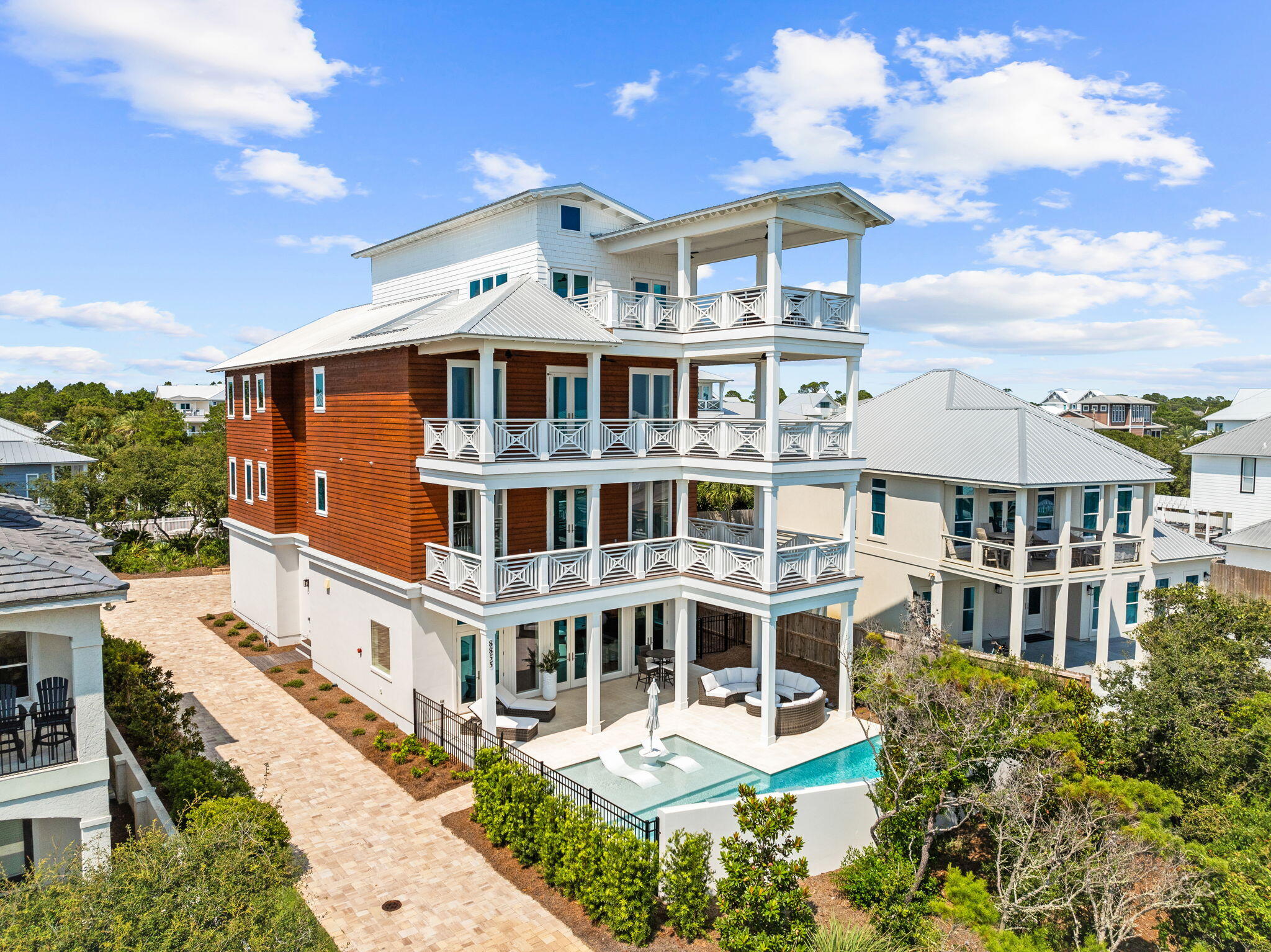 Step into a realm of coastal luxury with this stunning 6-bedroom, 7-bathroom house that redefines relaxed sophistication. Boasting 6,561 square feet of elegantly appointed living space, this home is a haven of comfort and style, perfectly placed almost thirty-five feet above the coastline promising breath-taking views. Each bedroom, including two luxurious primary bedrooms, offers serene privacy, opulence all accessible via the 4-story elevator. The heart of the home features an entertaining floor plan, perfect for hosting gatherings large and small. A chef-grade kitchen flows effortlessly into expansive living areas and continues to the secluded outdoor living space including a heated pool with sun shelf, dining area and a beach access across the street. Experience the pinnacle of outdoor living surrounded by lush landscaping, ideal for those long, sun-soaked Florida afternoons and the Gulf of Mexico just steps away. Nestled in a vibrant community, your new home is just a stone's throw from essential shopping at Publix Super Market and minutes from upscale leisure at Alys and Rosemary Beach. Whether you're in the mood for a beach day or an evening at The Hub with the kids, everything is within easy reach via the extensive 26 mile bike path that connects all of the beach communities. With potential for lucrative rental income, this property is not only your dream home but also a wise investment. Ready to dip your toes into a life of unparalleled luxury and convenience? This house isn't just a must-seeit's a must-have!