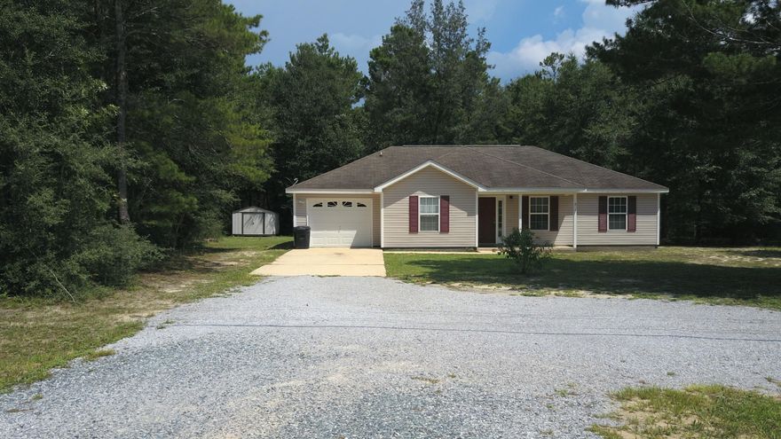 Come enjoy this freshly painted 3bed/2bath/1 car garage on a large1.4 acre lot conveniently located in Mossy Head. The entryway welcomes you to a large family room with cathedral ceilings and laminate flooring. The dining area is open to both the family room and kitchen. The large galley style kitchen offers ample counter and cabinet space and with freshly painted cabinets. The master suite features a large closet and separate bath. The split bedroom design offers 2 additional bedrooms with ample closet space. The oversized laundry room just off the kitchen offers plenty of room for additional storage or deep freezer. A one year home warranty is being offered for the new buyers piece of mind. Schedule your personal showing today!