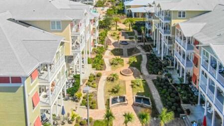Investor's Dream with some TLC! This 2BR/2.5 bath condo is located in beautiful Island Reserve, a gated community in the heart of PCB! This condo is very spacious and features bamboo floors, stainless steel appliances and granite counters in the kitchen, 10'ceilings with some crown molding, and lots of closet space. The balcony off the unit has a garden view and the outside of the buildings were recently updated. On-site amenities include a one-acre lagoon style pool with fountains, fitness center and basketball court, gaming room, movie-theater, and a beautifully landscaped courtyards. The complex is less than a 5 minutes drive to the beaches and 15 minutes from Pier Park. Photos shown not from unit, but a like floor plan. All info is approx and must be verified by Buyers if important.