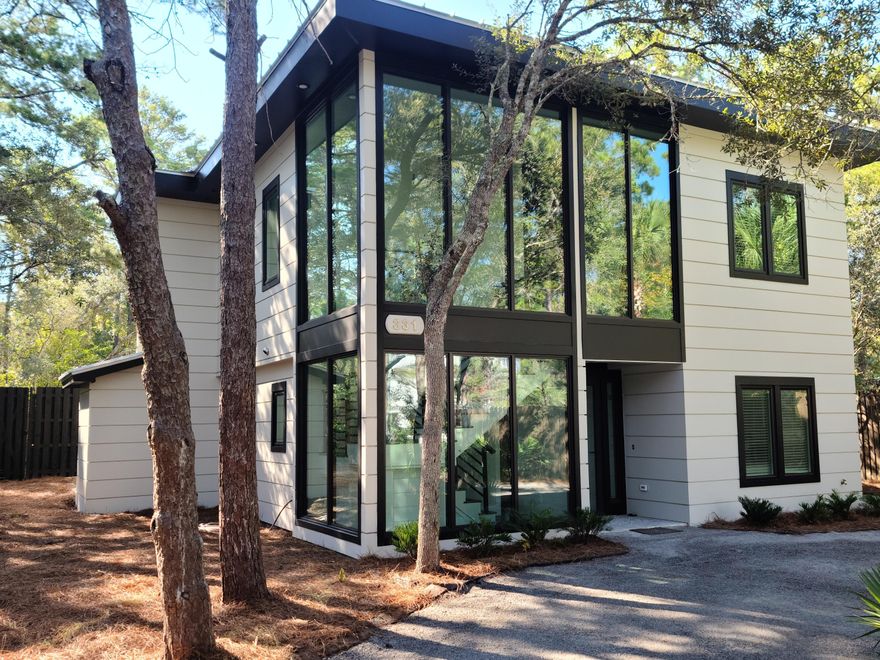 Experience new, contemporary construction on one of the most pristine, private lots in Old Seagrove. From the street, this home makes a modern statement--two stories of expansive glass sheets rise, creating unobstructed views of natural wonders as light floods the entryway. This custom-plan provides wonderful interior living with two master suites--each with a beautiful master bath. Both floors offer full living areas. The downstairs living walks out to a backyard sanctuary, with a heated, saline pool & spa as well as a covered patio with gas hearth. Impeccably manicured, the outdoor landscape provides maximal privacy. The home is set back off Canal Street while also embracing a sizeable backyard den for poolside relaxation. One of the sellers is a FL. Lic. Real Estate Agent