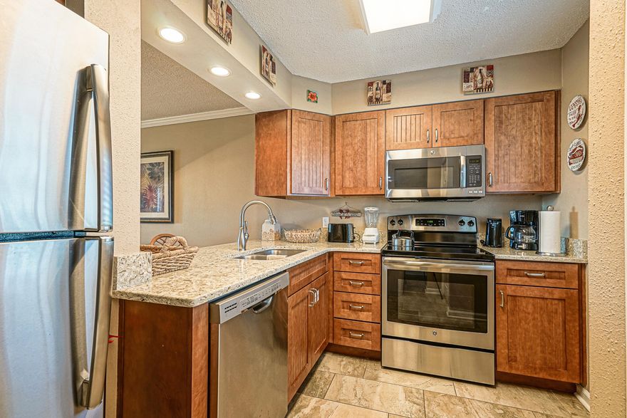 What an opportunity to own a 2 Bedroom, gulf view condo in Destin under $450k!  This beautifully remodeled condo is turnkey and rental ready. The kitchen has been totally renovated with new cabinets, quartz countertops, and stainless steel appliances.  Rectangular maintenance free tile has been laid throughout the entire condo, so there is no carpet to deal with!  This condo also features crown molding in the main area and plantation shutters in the bedrooms.  The master bath has also been updated with a new double vanity with quartz countertop and a walk in shower.  Enjoy sitting on your balcony watching the boats come and go through the Destin pass.  Islander has its own deeded beach access with plenty of space for all your guests!  Call today before this one is gone!