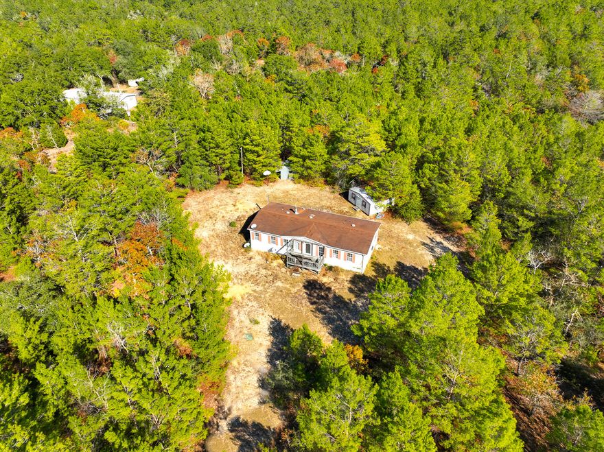 Centrally located between all major cities in the area. 5 acres of land surrounding the home, lots of potential with lots of open space and a fireplace in the living area. Needs some updating but has lots of potential. **When showing please be careful coming up onto the front porch, it is missing the steps to walk up onto the front deck**