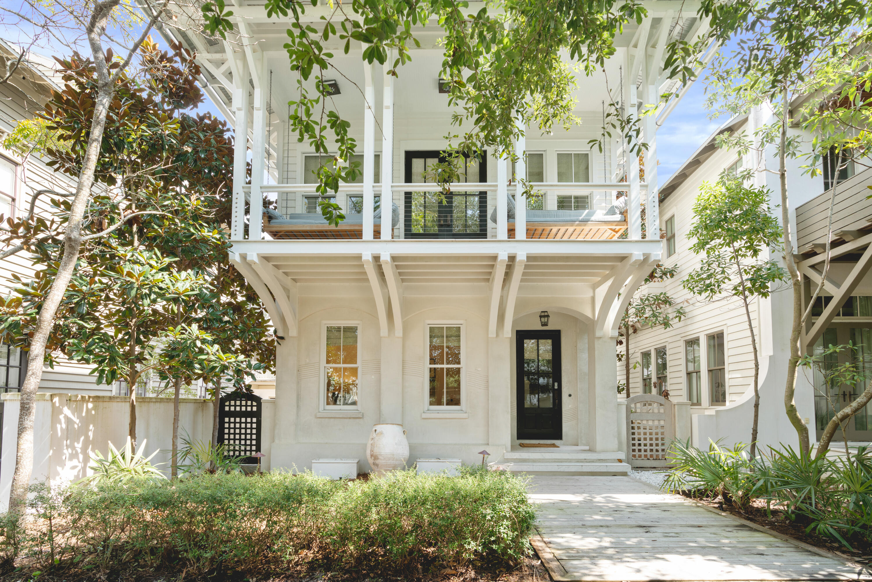 Serene, sophisticated and nothing short of sensational. This custom beach home embodies the true meaning of relaxed elegance while living up to the world class, family fun atmosphere that Rosemary Beach is known for. The spacious main house boasts four bedrooms and three baths and just across the inviting courtyard the carriage house contains two bedrooms and two full bathrooms. The first floor of this home has a comfortable den with seating for 4 and a flat screen TV, a great hangout for the kids. Off this den is a bunk room with 2 full beds, a flat screen TV and an attached bathroom with a large walk-in shower. Continuing down the hall, you will find the first king bedroom with attached bathroom. The bathroom attached to this bedroom has a vanity with granite countertops and a tiled