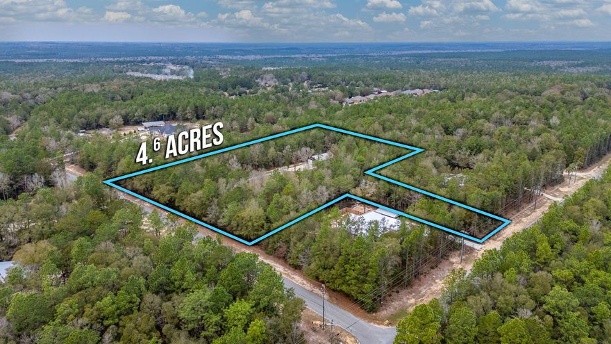 4.64 acres with a second homesite clear and ready. Escape to the country charm of Northwest Crestview with this unique property offering endless possibilities! This listing features a beautiful 3-bedroom, 1-bathroom barndominium, perfect as a guest house or a cozy retreat.  Imagine welcoming friends and family to their own private space, or enjoying the quiet tranquility yourself.Beyond the barndominium, this property presents a fantastic opportunity to build your dream home.  The main homesite is prepped and ready with underground power already in place - all you need is your vision and house plans!  Design the custom home you've always dreamed of, perfectly situated on this beautiful piece of land.Enjoy the laid-back lifestyle of Northwest Crestview, while still being convenient located by all the action.  With easy access to Hwy 85, Hwy 90, and Interstate 10, you can effortlessly reach the stunning beaches of the Emerald Coast, premier shopping destinations, and exciting entertainment venues.  Crestview itself offers a wide array of amenities, including diverse dining options, convenient shopping, and local entertainment, ensuring you're never far from everything you need.  Don't miss this chance to create your ideal country escape with the perfect blend of peaceful living and convenient access to everything Northwest Florida has to offer!

Zoning is Rural Residential
