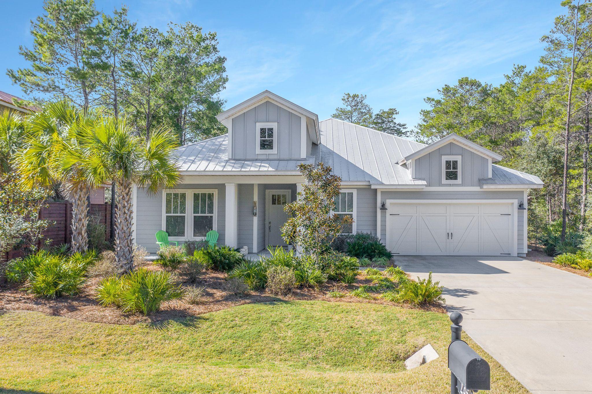 You'll love this delightful single-family home located on a private street just minutes from the beach. This popular wide-open floorplan is an entertainer's dream. Upon entering this home, you are greeted by a spacious foyer and can't help but notice attention to detail throughout with the extensive trim package and beautiful coffered ceilings. This 4 bedroom, 3 bath home has approximately 2,528 square feet, 10' ceilings, gorgeous dark hardwood floors throughout, designer kitchen with stainless appliances, granite countertops, extra-large island, ample cabinet space, expansive pantry, dining nook with extra entertaining space and wine fridge. Home also includes a large laundry room with built-in shelfing, separate mud room, dual 50-gallon hot water tanks, Nest(r) thermostats, and 2-car