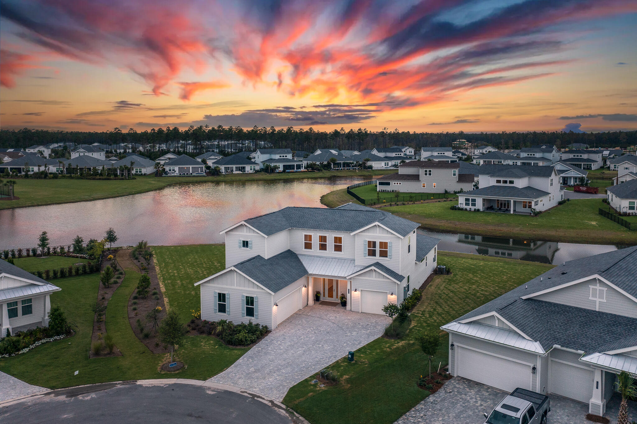 Explore the tranquility of 30A with this expansive property, nestled in the heart of NatureWalk away from the hustle and bustle of tourist areas. Positioned as the largest and finest lot, it boasts a serene lakefront setting, elevating its picturesque charm and granting sweeping views of the peaceful waters. Situated within a secure gated community just a short 5-minute drive from Rosemary and Alys Beach, it offers easy access to the charming shops and eateries along 30A. Despite its proximity to amenities, it ensures privacy within a well-established community catering to permanent residents, with no short-term rental properties. This meticulously crafted home demands minimal upkeep, ideal for families seeking ample space or grandparents welcoming loved ones.