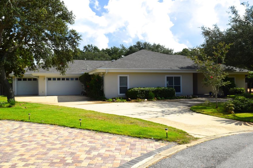 Spacious home perfect for entertaining! 3-CAR GARAGE with WALK-IN WINE COOLER, split bedroom floor plan, LARGE MASTER SUITE with two walk-in closets and adjacent BONUS ROOM -- ideal for a home office, nursery or studio. Enjoy the chef's kitchen with plenty of storage and walk-in pantry, custom built-ins and fireplace in the living area, large laundry room, custom book shelves in the guest area, 12'x48'5'' screened porch and privacy fenced backyard with space to park your boat or trailer. House built with top quality, metal frame construction. NEW hurricane shutters just installed. Circular drive offers plenty of parking, and the large lot/culdesac location ensures privacy. Convenient to Hurlburt Field, Walmart, Publix, Schools and Beaches. Hot tub & yard building convey as-is