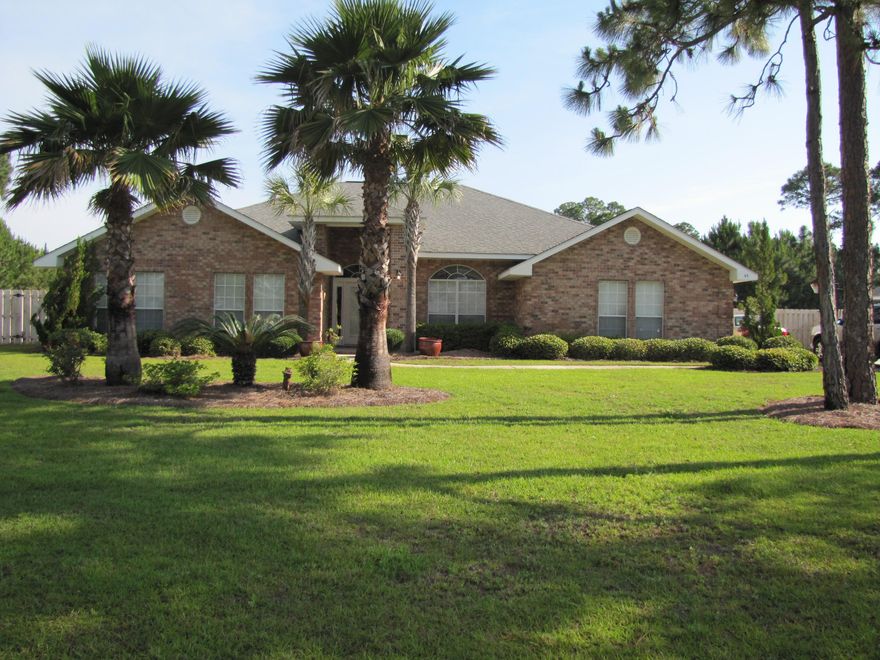 3000 square feet all brick home in Santa Rosa Beach! Sold As Is with right to inspect. This home has great potential & an open and spacious floor plan. Moms & cooks will love the huge island kitchen with corian counter tops. The entry way, kitchen, breakfast room, & bathrooms are all tiled. The huge family room has an electric fireplace, plant shelves, & high ceilings. There are 4 bedrooms, 3 full baths, & formal living and dining rooms. Office too! The lot is landscaped & the backyard is huge! Great space for a big pool! 6 foot wood privacy fence. Protected land behind home. Driftwood Estates is a bay front subdivision conveniently located near Sacred Heart hospital, Grand Blvd shopping center, & the beaches of South Walton County! All dimensions & information should be verified by buyer.