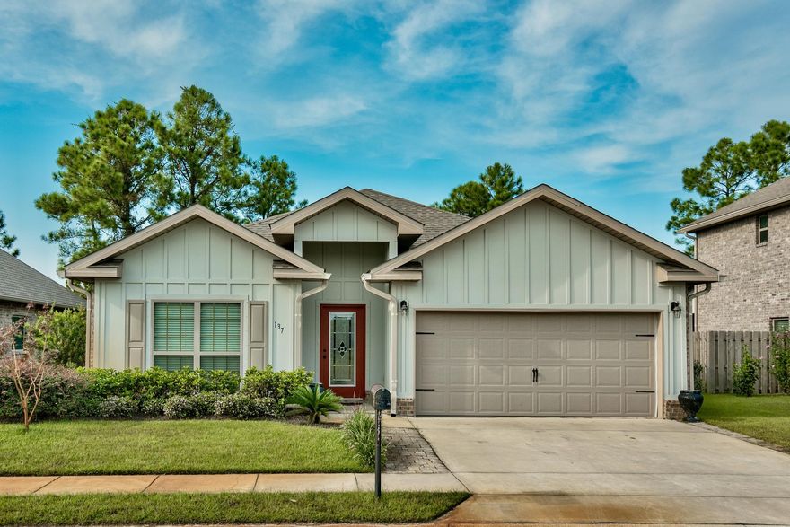 With curb appeal that includes mature landscaping, board and batten exterior, flood lighting after dark and a stained glass front door, this charming home beckons the home buyer with a penchant for comfy style and single-floor living. From the entry foyer, one can bear left into a pleasant den or straight ahead into the open great room. The kitchen has granite counters, stainless steel appliances and a lovely breakfast counter with triple pendant lights that complement recessed ceiling and under cabinet lighting.
