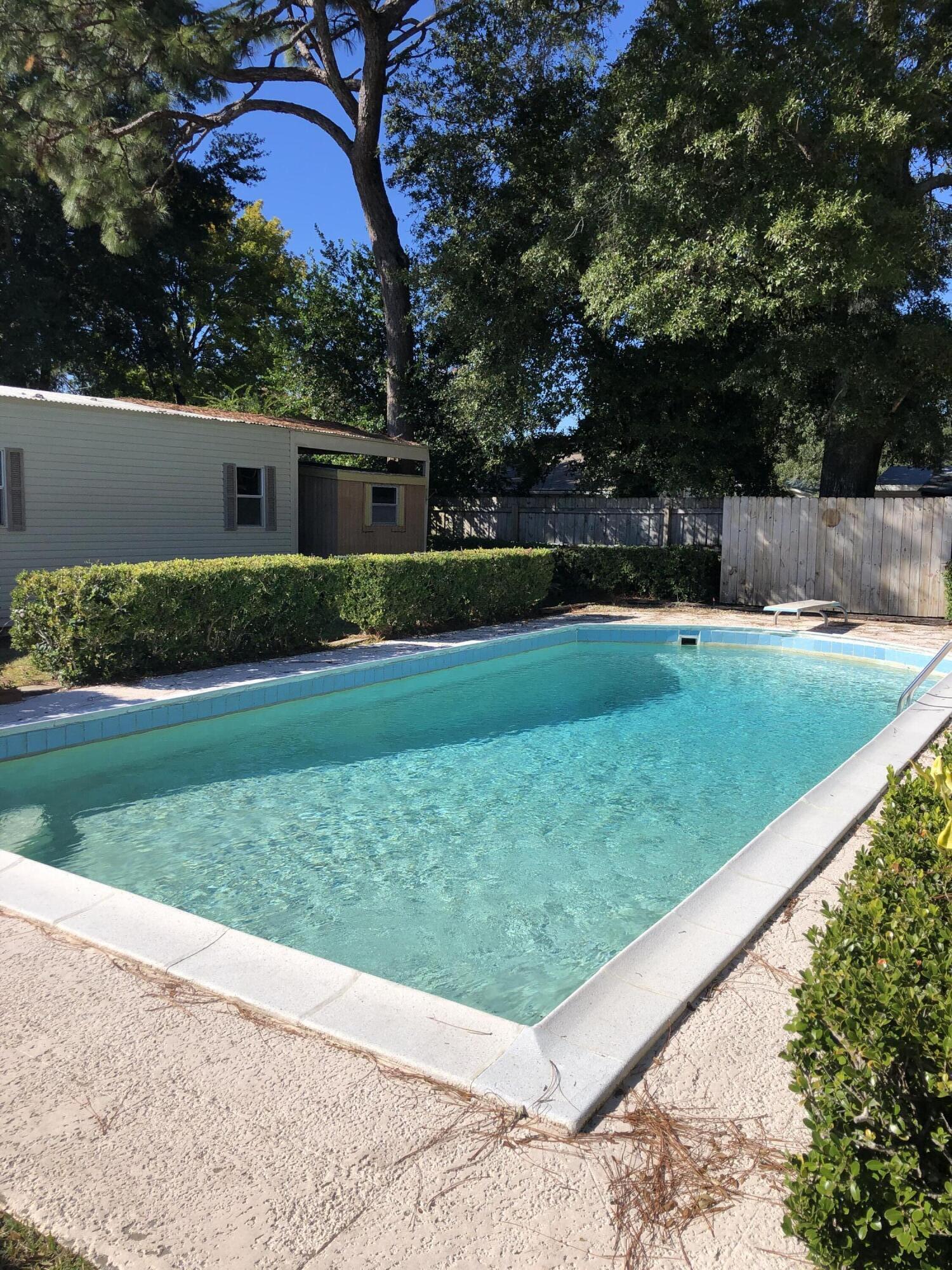 As-is sale which includes a step back in time. The owner enclosed the garage which could be formed into a 3rd bedroom with a separate entrance. It also comes with a Generac backup electric system run via natural gas in case of power outage, storm shutters and the home has been updated to pass a wind mitigation inspection. The backyard has a concrete pool and 4 storage buildings, 2 of which are equipped with A/C.
