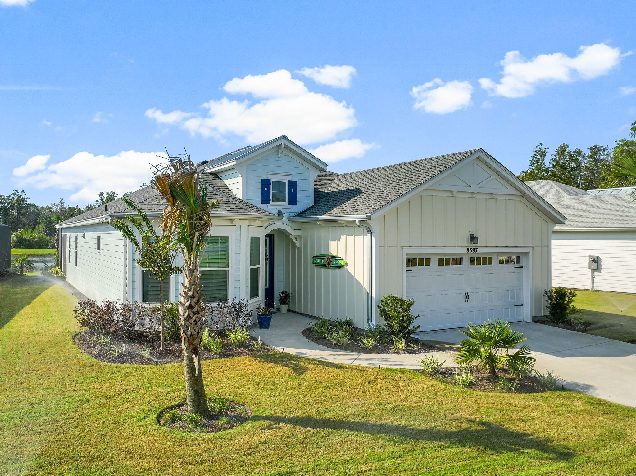 Spectacular WATERFRONT VIEW with PRESERVE BACKDROP on a premium lot located in the heart of Latitude Margaritaville Watersound, just 7 miles from the sugar white sand beaches of the breathtaking Emerald Coast. This BREEZE BAY Model home has the THIRD BEDROOM CONVERSION and 3 FULL BATHROOMS. Step into the foyer and be "wowed" by the stunning expansive view as your eye travels to the EXTENDED, SCREENED LANAI and beyond. Four sliding doors bring the outside into the huge open great room with vaulted ceiling and GAS FIREPLACE. The coastal blend atmosphere shouts easy and relaxed Florida living and is donned with elegant upgrades throughout. Gourmet kitchen has over-sized island with QUARTZ counters, linear glass backsplash, 42" soft-close cabinets with crown molding, pots and pans drawers, pull out shelving and under cabinet lighting. HIGH END STAINLESS STEEL APPLIANCES include built-in wall microwave and oven, 5 BURNER GAS COOKTOP with HOOD, refrigerator with 2 ice makers and dual zone WINE COOLER. Luxury master suite has coffered ceiling and bay; double walk-in master closets, extra drawers in bath, upgraded floor to ceiling tile, seamless glass enclosure, separate WC and linen closet. Second en-suite bedroom holds a king bed and has a custom shower with frameless glass, floor to ceiling tile and large linen closet. Third bedroom can also be a den, office or craft room and has easy access to the third full bath. Many extras include BUILT-IN LAUNDRY ROOM, custom PLANTATION SHUTTERS throughout, pull down attic steps to large, lighted storage area, laminate flooring, quartz-top key drop in hallway, sleek impact glass front door, ceiling fans and beautiful lighting. The location of this home is perfect! Hop on your golf cart and take a short cruise to the acclaimed amenity center where you can enjoy dinner at the Bar and Chill; take a swim in the resort-style Paradise Pool or the indoor lap pool; catch a spectacular sunset over the Intracoastal Waterway; meet up with friends for live music at the bandshell or work out at the state-of-the-art fitness center or at the pickleball or tennis courts. Your home is your passport to unparalleled active lifestyle in this highly acclaimed 55+ community in the Florida Panhandle. Schedule your private showing today.