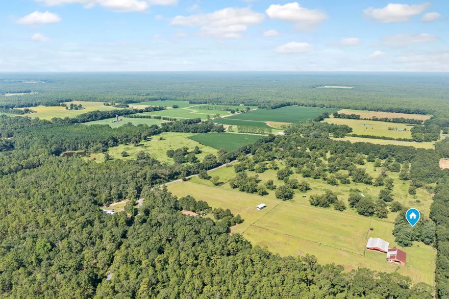 Calling all livestock owners looking for a new homestead to make their very own country oasis!! Located in the highly desired countryside of Baker, situated on a total of 14.6 acres. This two bedroom, two bathroom home offers a spacious open floor plan that is perfect for entertaining. Newer stainless appliances all throughout the kitchen, beautiful wooden counter tops for plenty of prep space, lots of cabinets for all your storage needs! Following the hallway to the back of the home you will come to the master bedroom, boasting tons of floor space and a master bathroom with plenty of natural light, along with the extra bedroom directly across the hallway. The exterior of the home offers several structures for all your livestock needs! An already established 80'x75' pole barn, 60'x80' stable barn, 16'x35' tack room, 8 horse stalls, as well as a brand new pole barn 24'x48' in the front pasture. There is cross fencing all throughout the property with gates to keep livestock separated and continually rotated in fresh green pastures. There are also (4) 50 amp electrical hook ups established in the front pasture for versatile storage of campers or for climate controlled camper storage or maybe a new business venture for rentals (buyer to verify laws and regulations pertaining camper rentals). Come bring your horses, cows and more and make this great property your own wonderful homestead with all your livestock ready to move right in with you!