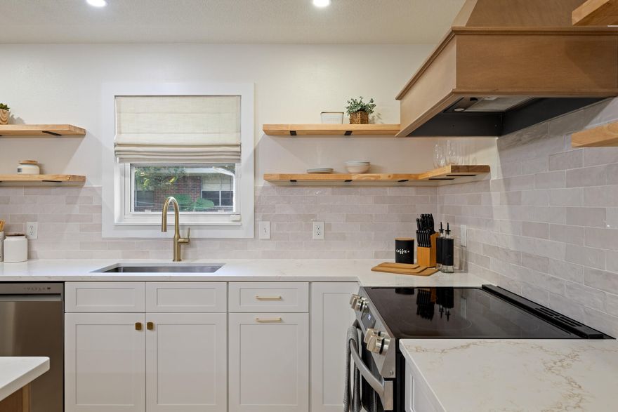 Back on Market at $449,900 - Buyer Got Cold FeetRenovated to Inspire. Staged to Impress. Move-In Ready in Niceville's Carol Ann Manor. On a corner lot in one of Niceville's established neighborhoods, this 2,021 sq ft home blends mid-century character with a sleek, modern revival. Originally built in 1974, it was taken down to the studs and completely reimagined inside and out so you can enjoy the charm of the era without sacrificing today's style or convenience.The kitchen is the showpiece with quartz countertops, a large center island with hidden storage, open shelving instead of upper cabinets, and textured subway tile that adds depth and dimension. A custom butler's pantry with butcher block counters and smart organization keeps everything in its place.An open layout connects the dining area to the sunken family room, where a wood-burning fireplace anchors the space. Luxury vinyl plank flooring, designer fixtures, and hand-selected finishes bring a cohesive, intentional feel throughout.

The main bathroom delivers everyday luxury with a double vanity featuring brushed brass fixtures, era-appropriate designer tile, and a fully tiled shower/tub combination. The primary suite features two sunlit windows, a walk-in closet with custom organization, and a striking ensuite with ceiling-height tile, a sleek vanity, and glass barn doors.

A light-filled Florida room extends your living space and opens to a shaded backyard with mature trees and a brand-new privacy fence.

With updates including a new roof, upgraded electrical, custom closets, and top-to-bottom finishes, this home is truly one of a kind in Carol Ann Manor. At $449,900 and below fair market value; it's staged, move-in ready, and waiting for its next chapter.