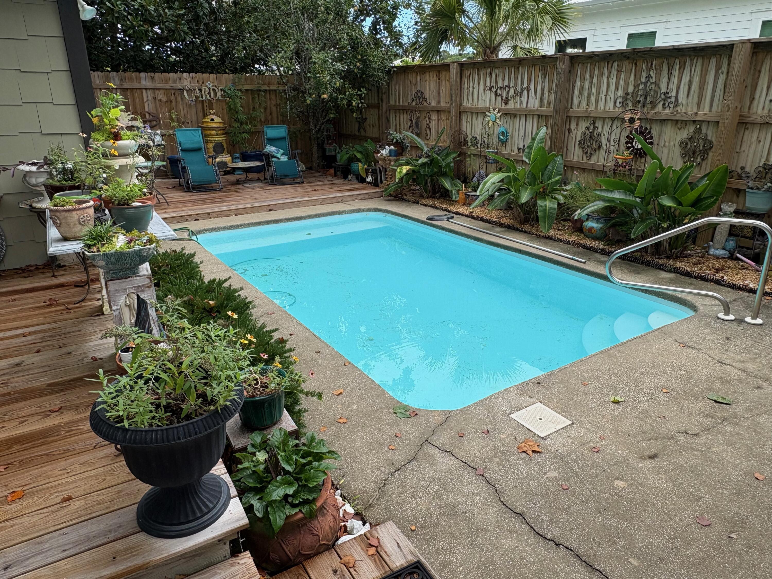 Ideal location in the First Addition of Gulfview Heights. Cool little Florida cottage nestled in the woods close to the Beach. Restaurants and shopping are close by. You must see this location in person! Trails everywhere, beach a few blocks away. The square footage taken from the county record, however, the Master wing was added, making the house more like 2,000 sq ft. The backyard has a 10 ft privacy fence. Oasis in the backyard with a nice pool.