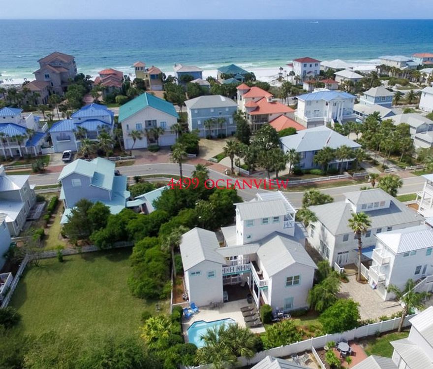 This charming Coastal Cottage is in one of Destin's premier beach communities. Crystal Shores features white picket fences, paved walkways and a great location close to the beach and walking distance to many of the best amenities Destin has to offer. This home site has a rare private pool that sits in a lushly landscaped courtyard by the Main Home and Detached Carriage House with a garage. It has been redecorated and the floor plan opened to allow for a great gather place. The carriage house has a kitchenette, bedroom and bathroom. The lot allows for privacy in the heart of the community. The bunk room allows for extended rental capability or helps accommodating larger families.