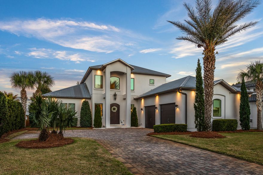 Experience the craftsmanship in this meticulously maintained home on the West end of 30A, being sold fully furnished for a true turnkey opportunity. Never rented before, this property boasts immaculate interiors and offers a rare sense of exclusivity. Located within the private, gated community of Cypress Breeze, this custom-built residence combines luxury amenities, thoughtful architecture, and timeless sophistication.As you enter the foyer, the soaring ceilings and elegant staircase immediately highlight the home's impressive design. The open-concept great room is ideal for entertaining, featuring a gas fireplace as its focal point. French doors lead to an outdoor oasis, where lush landscaping frames a spacious open-air living area. Relax by the gas firepit as the evening sets in, creating the perfect ambiance for coastal nights under the stars.  Inside, the chef's kitchen is a dream come true, outfitted with premium Wolf and Sub-Zero appliances, a Sub-Zero beverage center, an ice machine, a walk-in pantry, and more.  Stone countertops and high-end plumbing fixtures underscore the exceptional quality of this culinary space.  The primary suite is conveniently located off the great room.  Its spa-like en-suite bath boasts a freestanding soaking tub and a walk-in glass shower, offering a true retreat.
The main level also features a stylish powder room, a spacious laundry area, and an oversized two-car garage with an integrated workshop.
Upstairs, guests will enjoy a private suite, two additional guest bedrooms, and a beautifully designed guest bath.  The upper level also houses a fully equipped media roomperfect for movie nights, football games, and entertaining.  A wet bar and custom storage complete this inviting space.
Cypress Breeze offers a private, gated community experience with resort-style amenities, including an oversized pool, located just a short stroll from the beach.  Enjoy easy access to the best of 30A'shigh-end dining, world-class shopping, and premier entertainment.