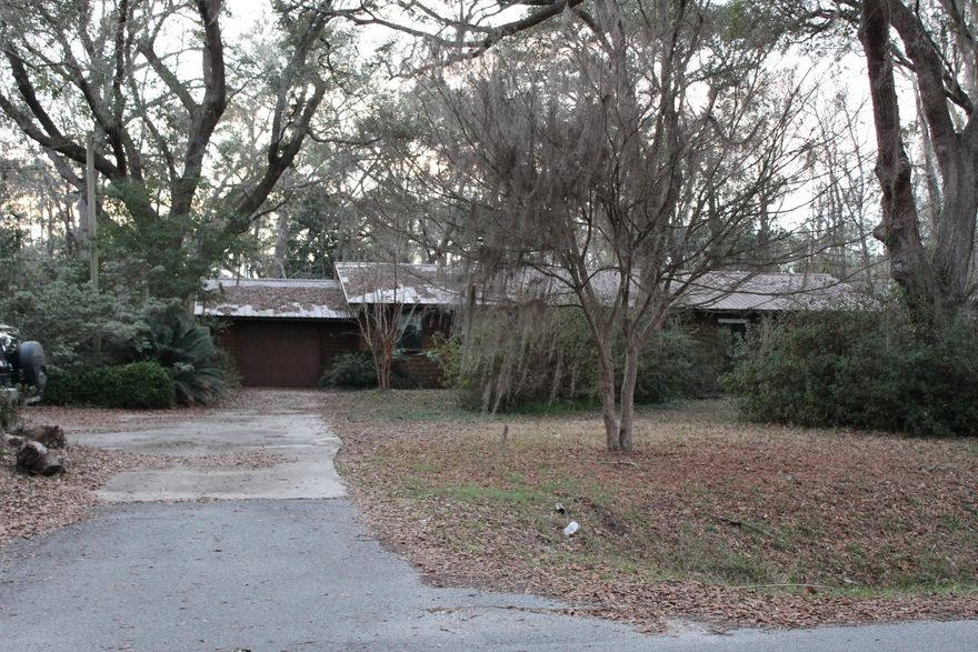 Here's your chance for a fantastic deal on a great piece of property near Mallet Bayou. This almost half-acre lot is full of great landscaping and gorgeous live oaks. House features a fireplace, 3 Bedrooms, 2 Bathrooms, mudroom, serene patio area and a little half baskeball court. Property sold ''As Is.'' All closings are subject to the recording of the foreclosure deed. Submitted offers must include buyer-signed contract, proof of funds/pre-approval letter and earnest money check. Seller addendums will be provided for signature with accepted offer.
