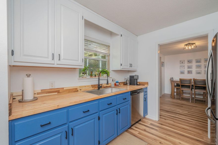 Beautifully updated home on a spacious .46-acre lot in Holley By the Sea! Centrally located near Navarre's beaches, dining, and military bases, this well-maintained property features a renovated kitchen, new interior paint, updated fixtures, & LVP flooring throughout (tile in laundry room). Enjoy a functional split floor plan! French doors from the dining area lead to a screened-in patio, perfect for relaxing while overlooking the tree-lined backyard with a brand new privacy fence. A storage shed provides added utility. Major upgrades completed: NEW ROOF (2024), NEW HVAC (2025), and NEW WATER HEATER (2024)! As a resident of Holley by the Sea, enjoy resort-style amenities including pools, tennis, fitness center, boat ramp, and more. This move-in ready home offers comfort, space and value!