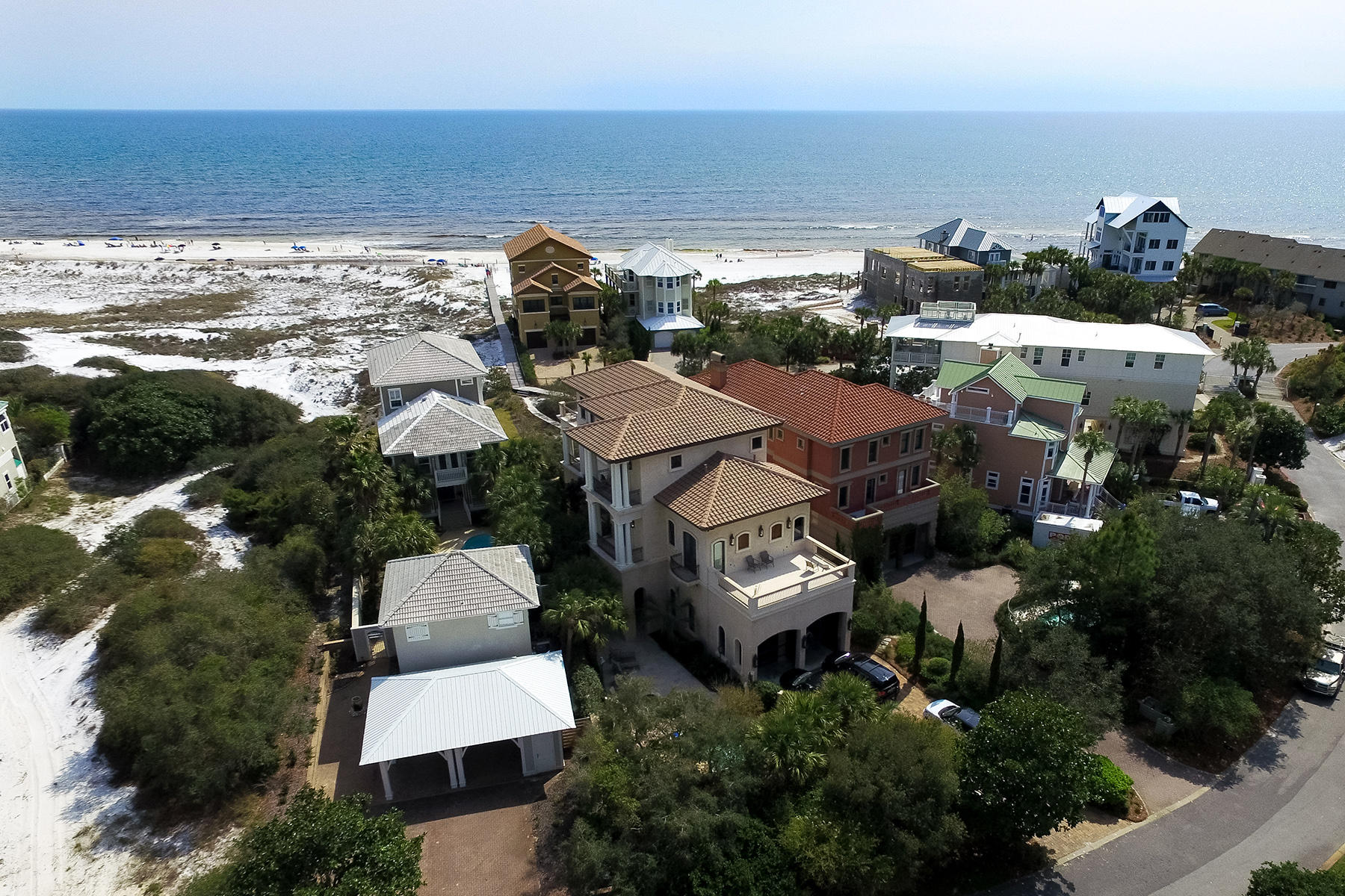 Combining old world charm with forever gulf views, Villa Sienna provides the perfect beach home with direct access from the rear patio to the beach along a rustic boardwalk. Designed by Architect Victor Bowman and built by Alan Ficcara, this reinforced cement home with pool was created for generations of families to enjoy. Wood is an important element in the home, with mahogany doors, wood burning fireplaces and heart of pine flooring repurposed from an early 1900s schoolhouse. Modern touches such as Herd hurricane windows, elevator, geothermal heat and three separate air conditioning zones speak volumes about the thought and care invested in this residence. The impressive open architecture of the main living space incorporates a generously sized, well appointed kitchen which is (see More)