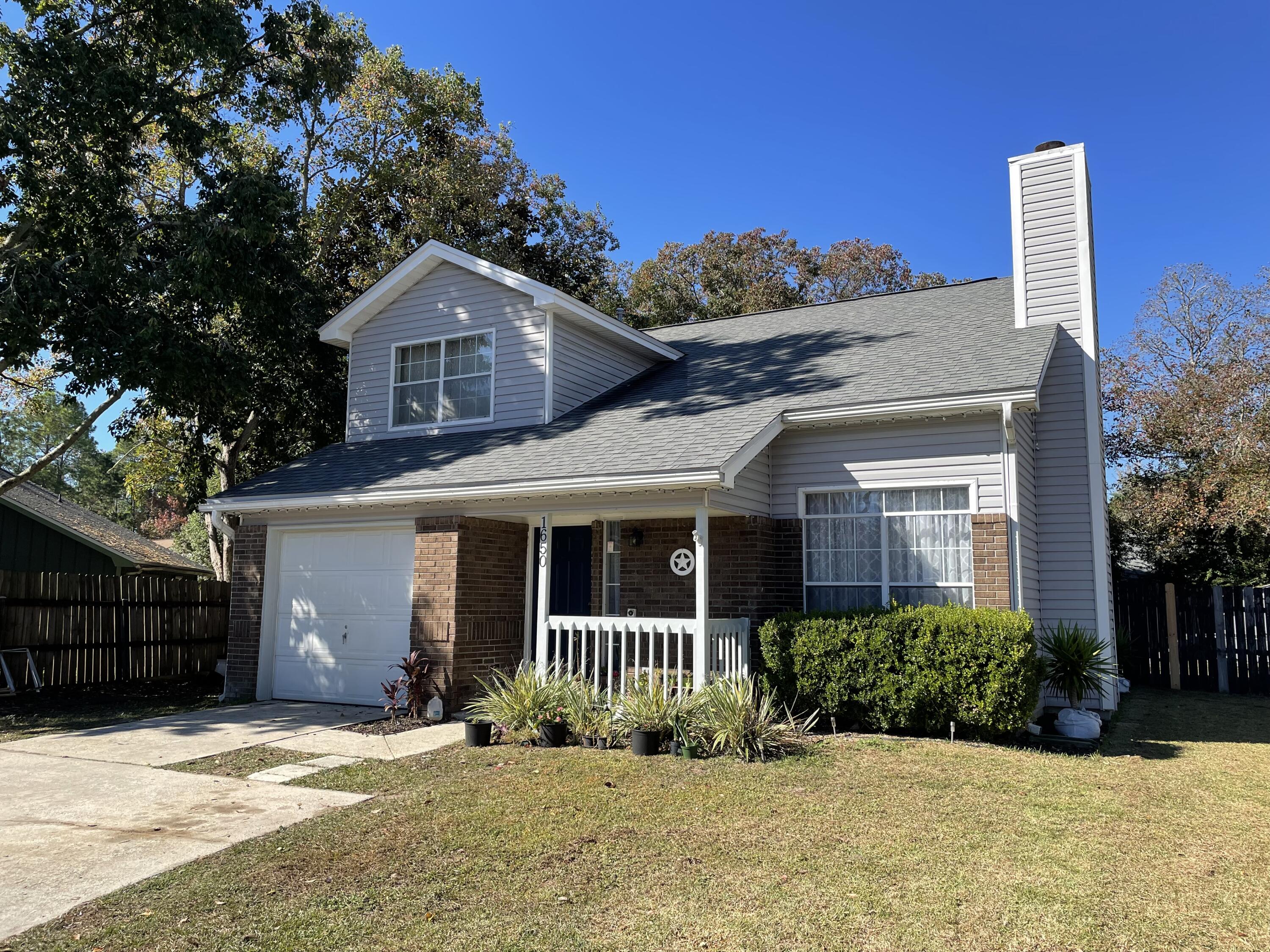 Available for move in beginning immediately! Conveniently located between Eglin and Hurlburt Field at the end of a cup-da-sac. There is a fireplace in the living room, high ceilings and oak floors through the living room, stairwell and hallway upstairs. Spacious kitchen with eat in dining area. 1 bedroom and full bath downstairs. Upstairs is 2 bedrooms & 1 full bath, as well as a loft space with closet that could be used as another room or office. Spacious fully fenced back yard.