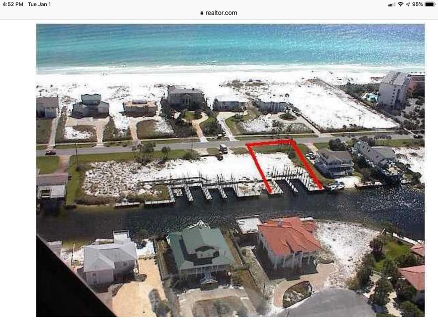 Build your dream home in prestigious Holiday Isle. Best remaining lot on the Destin canals. 90 feet of waterfront and two large boat slips for your yacht up to 48' Fantastic views of the gulf, with private beach access just across the street.Owner has preliminary architectural drawings from a leading local designer.