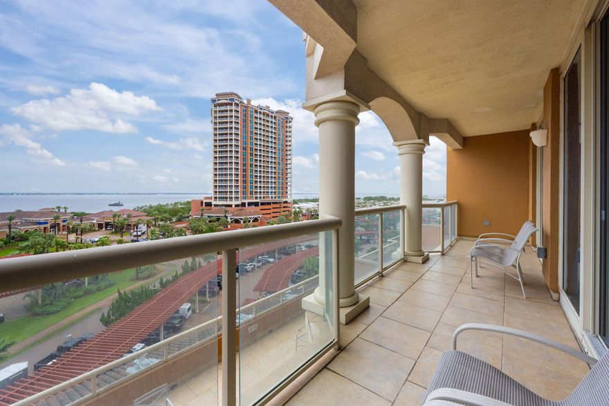 Welcome to luxury coastal living at Portofino Island Resort! Rental projections coming in at $79,000+! This spacious 2-bedroom, 2.5-bathroom condo offers the perfect blend of comfort and elegance in one of Pensacola Beach's most sought-after communities. Step inside and enjoy stunning views from the moment you walk in. Located in the heart of the resort, this spacious unit features an open floor plan with tile flooring and neutral paint throughout, creating a clean and inviting atmosphere. The full kitchen is well-equipped with ample cabinet space and a panel-ready refrigerator, all opening to a generous dining area and breakfast bar. The living area is bright and airy, with large glass doors displaying views and leading to a 27-foot-long balcony where you'll enjoy overlooking the San ta Rosa Sound and the resort's tropical landscape. Both bedrooms are private retreats with en suite bathrooms and direct access to the balcony. The primary suite boasts multiple closets and a luxurious bathroom with all you could want! It boasts double vanities, a jetted whirlpool tub, a walk-in tile shower, and a separate water closet. The second bedroom, located on the opposite side of the condo, also includes its own full bathroom for added privacy. Portofino Island Resort offers unparalleled amenities including direct access to both the Gulf of Mexico and the Santa Rosa Sound, multiple pools and spas, a full-service spa, a state-of-the-art fitness center, tennis courts, and on-site dining. Only minutes from the dog park and all that Pensacola Beach has to offer, this condo will make you feel at home and on vacation all year long!