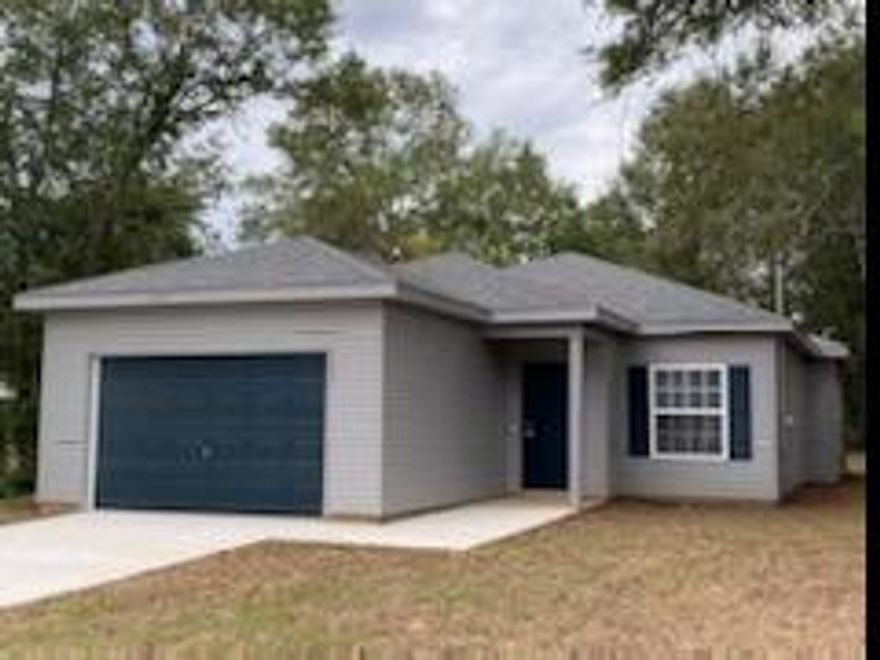 Only built a few years ago! 3 Bedroom, 2 Bathroom Conveniently located to shopping and schools. This 3 bed 2 bath is brand new with a spacious open floor plan.. When you walk in you will notice the unique stained concrete floors that are both beautiful and low maintenance. The kitchen has a large island with sleek modern cabinets and lighting. The master bath features a shower tub/ combo with a larger vanity. There is a split floor plan with the 2 guest rooms and their adjoining guest bathroom on the opposite side of the home as the master bedroom. A lovely covered back porch for entertaining with a newly sodded yard and views of the wooded areas behind the property.