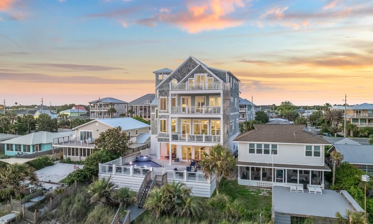 Highest-Earning Vacation Rental Home On The Emerald Coast With Over $2.3M Generated Since 2022! Showcasing panoramic views across 55 feet of beach frontage, this stunning coastal paradise has been meticulously designed to host an unmatched experience. This beachfront home has already produced over $430,000 in rental income YTD with the capacity for 36 guests. Positioned just five minutes from Rosemary Beach, this massive home boasts four levels of breathtaking Gulf views. The enormous sized pool deck serves as a one-of-a-kind beachfront entertaining space with its heated pool, spa & private beach boardwalk. The first level displays a pool-side entertainment floor with a pool table, foosball table & arcade gaming system. The first level also features a comfortable living room, kitchenette, oversized island & elevator access to all four levels. The second floor serves as the main gathering space with the remarkable kitchen, stunning living room & ideal dining area. You and your guests can also dine alfresco on the large beachfront balcony. The chef's kitchen features dual ovens, a six-burner gas Wolf range, two dishwashers, a wine refrigerator, and a commercial Sub Zero refrigerator. The striking island has bar seating for six and the dining tables have seating for sixteen. The first level features two spacious guest bedrooms, both designed with queen over queen built-in bunks along & ensuite bathrooms. The second level has two bedrooms, one being a queen over queen built-in bunk room with an ensuite bath. And the other on this level is a primary suite with a king bed and gorgeous ensuite bath. The third floor flaunts one of the most spectacular primary bedrooms ever created on the Emerald Coast. This primary suite has endless Gulf views to the West through large windows & sliding glass doors. The primary also has a comfortable sitting area, kitchenette & walk-in closet. The dreamy primary bathroom has unbelievable Gulf views. The 3rd floor provides another queen over queen built-in bunk room with an ensuite. And additionally, there is a primary bedroom with a king & an ensuite on this level. As you reach the 4th floor, you're treated to another unrivaled primary suite with soaring top floor Gulf views. This top floor primary has a kitchenette as well along with another bright and airy primary bathroom. The top level has a one-of-a-kind bunk room with 3 sets of queen over queen built-in bunks while also featuring an ensuite bathroom equipped with two walk-in showers. The property conveys fully-furnished with strong rental bookings already in place for the new buyer. Rental income performance, rental income projections, estimated expenses and net income projections are available by request. Enjoy a luxurious coastal lifestyle five minutes from 30A and own one of the top-producing vacation homes on the Emerald Coast!