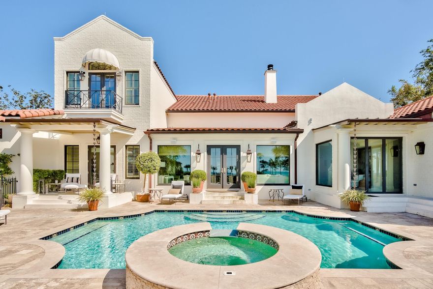 Timeless details and breathtaking views abound in this rare and private estate. Designed as an exclusive celebrity compound, this property is the only one of its kind in the prestigious gated community of Burnt Pine and provides privacy and safety for the most exclusive buyer or cautious family. As you enter the property through its own private gates and lavish courtyard, you find a lush garden framing the main home while the garage and guest house provide a beautiful enclosure from the quaint neighborhood street. Sweeping views of Choctawhatchee Bay water and the Burnt Pine Golf Course greet you the moment you step inside the stunning main residence. An entertainer's paradise at every turn, the classic white coral stone floors throughout the main living area and soft neutral tones layer