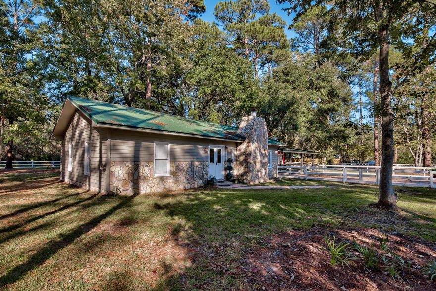 Bring Offers!!!This Classic Florida Ranch is a must See. This home is tucked behind majestic oaks and Pine Trees Giving this home an incredible tranquil setting. Situated on a 1/3 of an acre, this home has been renovated to include wood look tile throughout the house, Subway tile shower in the master bathroom, barn door to the master bath, new paint, craftsmen style trim, Wood cabinets , metal roof, gas range, 2 car carport, workshop and a Florida room with a/c connected used as a third bedroom. This home backs up to conservation perfect for entertaining and potential for a pool. Buyer and Agent to verify all dimension