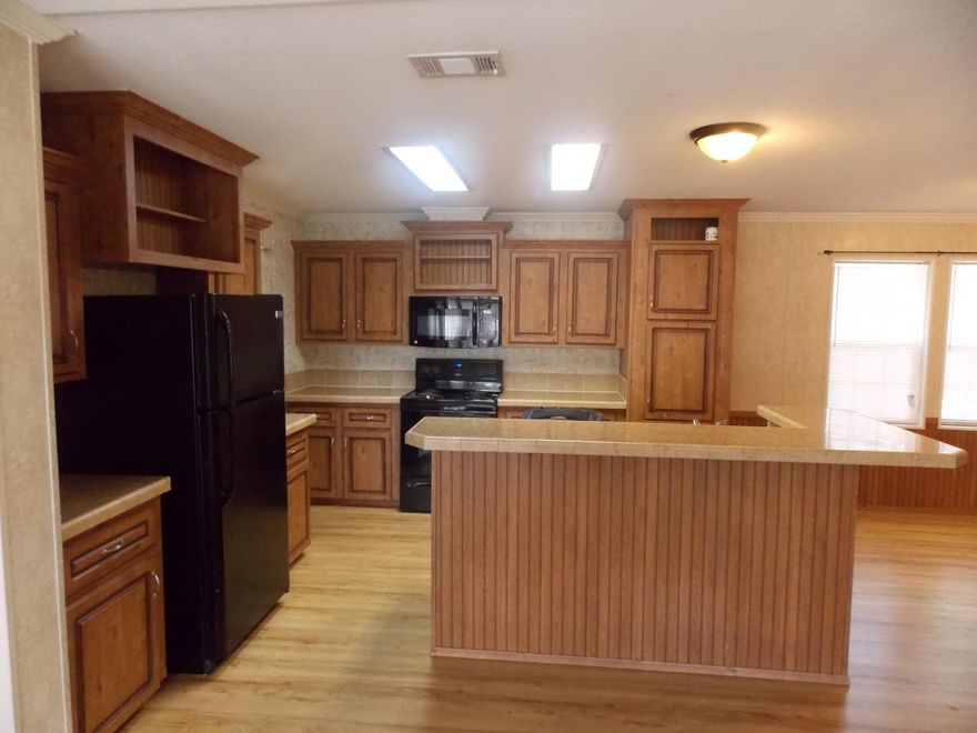 AVAILABLE FOR MOVE IN NOW!. This beautiful 3 bedroom, 2 bath manufactured home has over 1,600 sq feet of space. Located in the Bayshore Villas subdivision in the heart of Niceville conveniently located 20 minutes from Eglin AFB. Other features include gorgeous wood grained, modernized cabinets throughout, a large family room with wood burning fireplace and a separate master suite. Pet friendly with owner approval/nonrefundable pet fee. No smoking inside home.