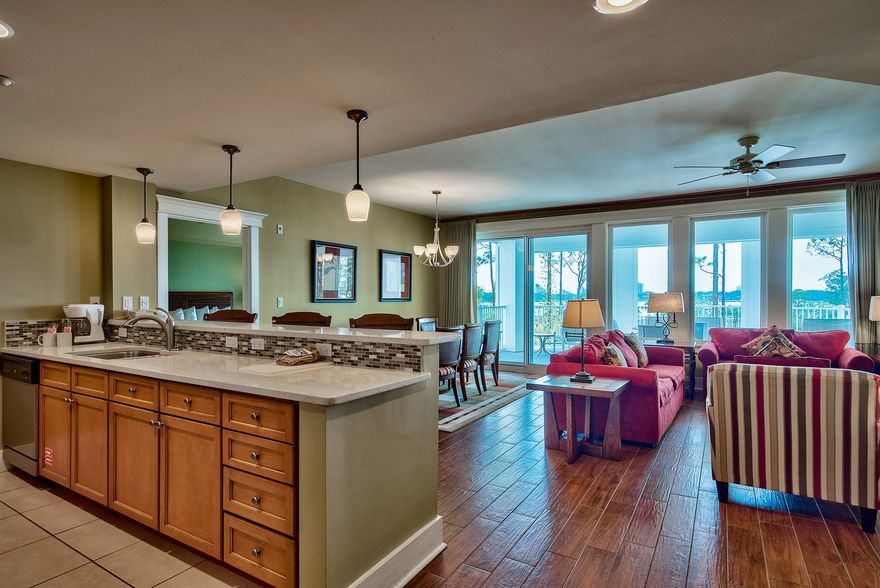 Breathtaking, panaramic views of the Baytowne Marina and Choctawhatchee Bay from the oversized semi-circle balcony. This condo is the largest 3 bedroom in Lasata and boasts two master suites plus guest bedroom, all of which share in the spectacular views of the bay. Floor to ceiling windows in the living area give this property the ''WOW!'' factor the moment you walk in. Updated with stainless steel appliances, white quartz counters, porcelain plank tile throughout the entire home, and flat screen televisions in each room. Offered fully furnished and rental capable. The size and layout of this condo would make for a great primary residence, 2nd family home or rental property. Lasata is located within the Grand Complex which boasts a sparkling resort-style pool, hot tub and fitness room.